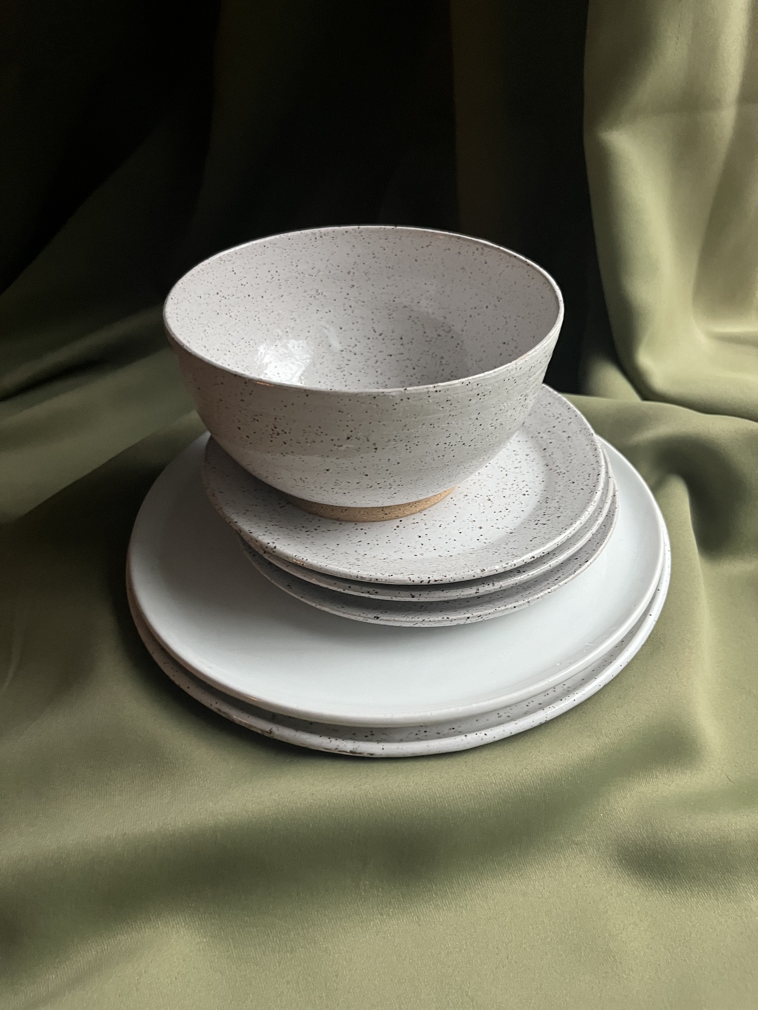 Small bowls and speckle-glazed plates